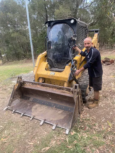 A skid steer loader on site